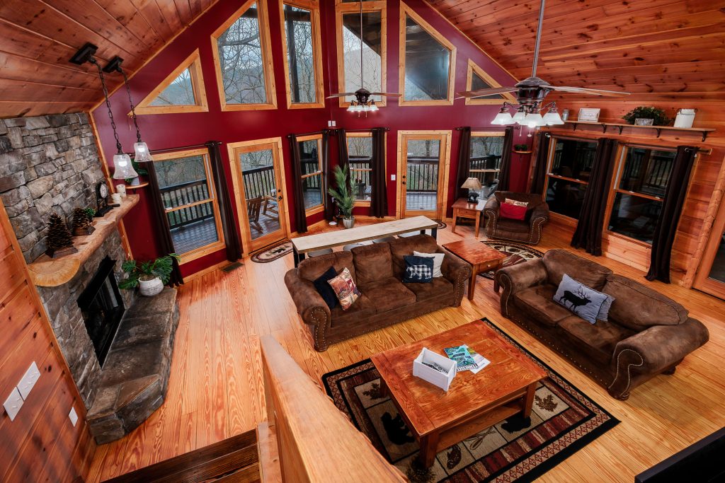 Two-story cabin great room from loft at a vacation rental in the Smoky Mountains.