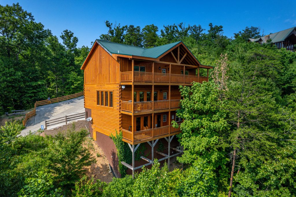 Three-story log cabin aerial exterior at a vacation rental in Sevierville, Tennessee.
