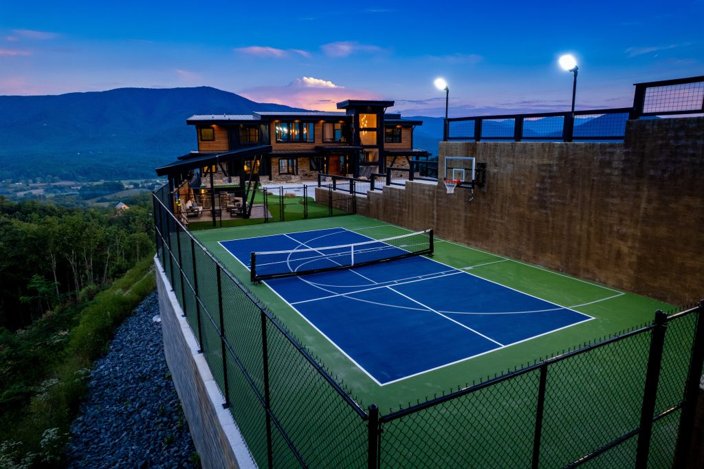 Basketball and pickleball court beside mountain cabin at a vacation rental in Wears Valley in the Smoky Mountains.