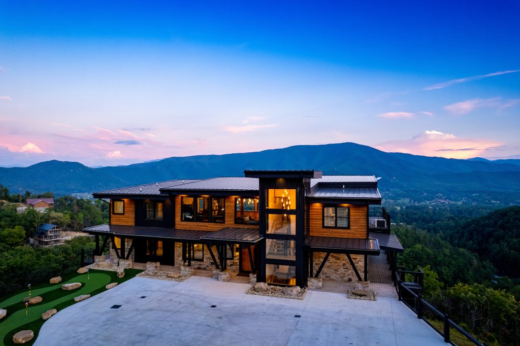 Luxury cabin exterior with mountain panorama at a vacation rental in Wears Valley in the Smoky Mountains.