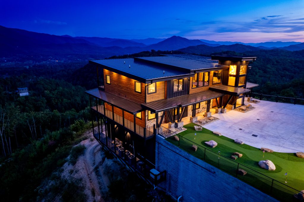 Luxury mountain cabin aerial at blue hour at a vacation rental in Wears Valley in the Smoky Mountains.