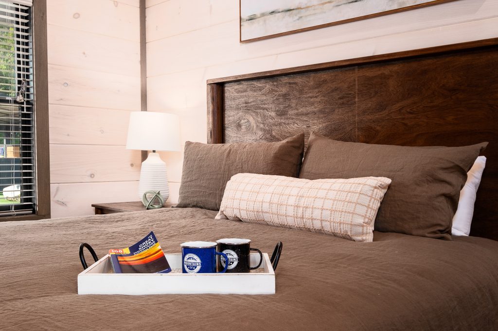 Styled king bed with breakfast tray at a vacation rental in Wears Valley in the Smoky Mountains.