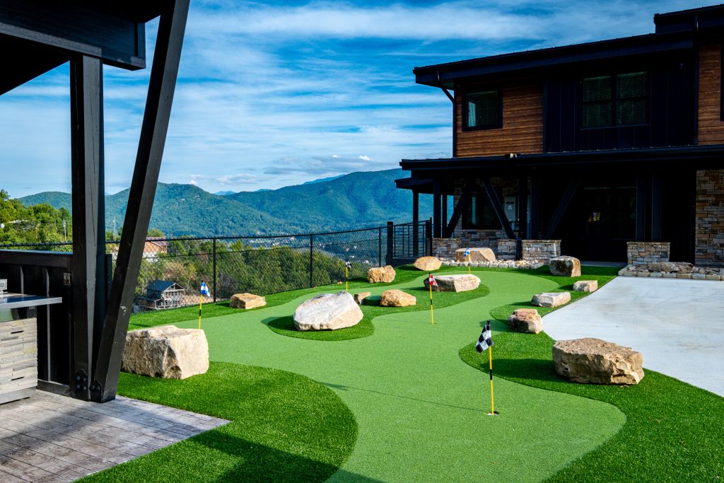 Private putting green with mountain views beside a luxury Wears Valley cabin.
