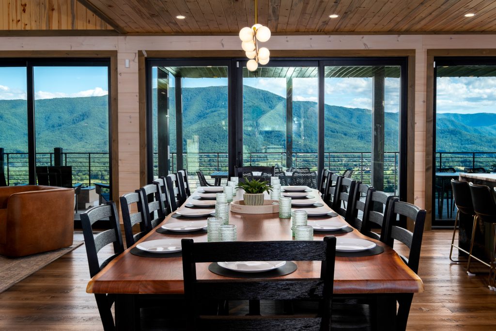 Long dining table overlooking the mountains at a vacation rental in Wears Valley in the Smoky Mountains.