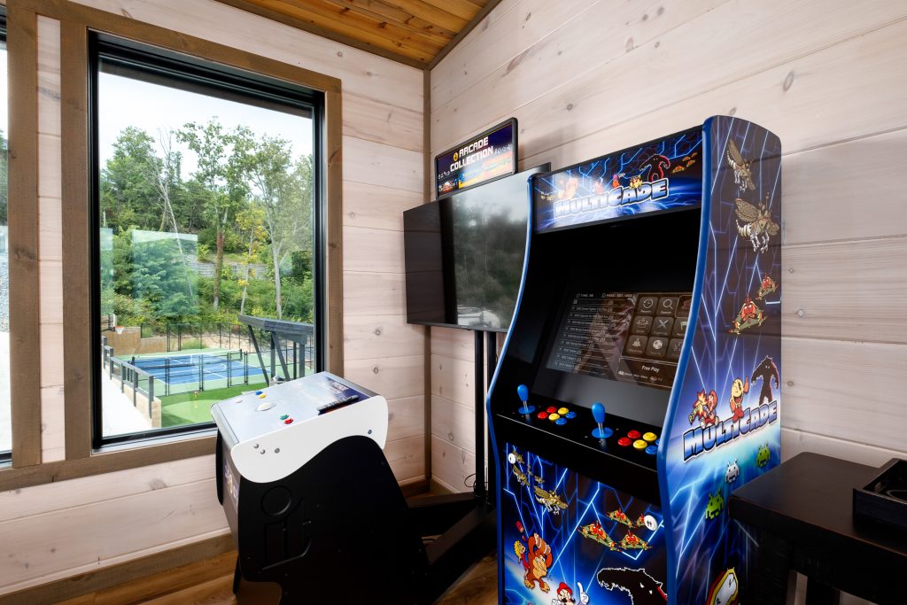 Arcade cabinets in mountain cabin game room at a vacation rental in Wears Valley in the Smoky Mountains.