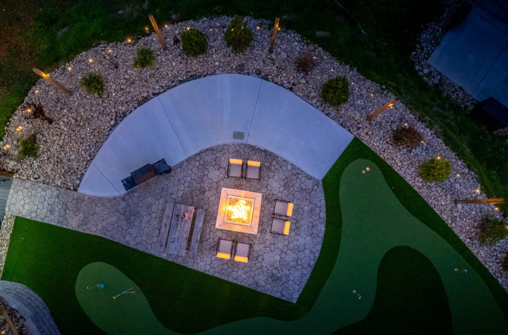 Putting green and fire pit aerial at twilight at a vacation rental in Pigeon Forge, Tennessee.