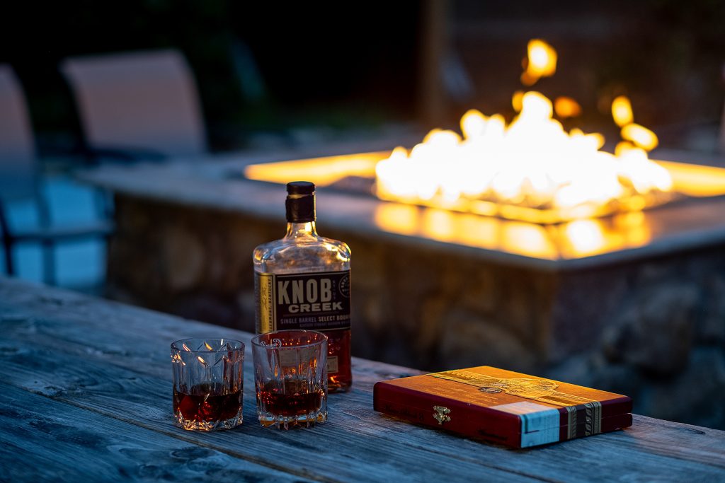 Whiskey bottle and fire pit detail at a vacation rental in Pigeon Forge, Tennessee.