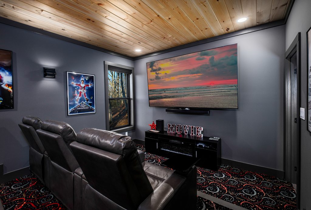 Home theater and arcade machines at a vacation rental in Gatlinburg, Tennessee.