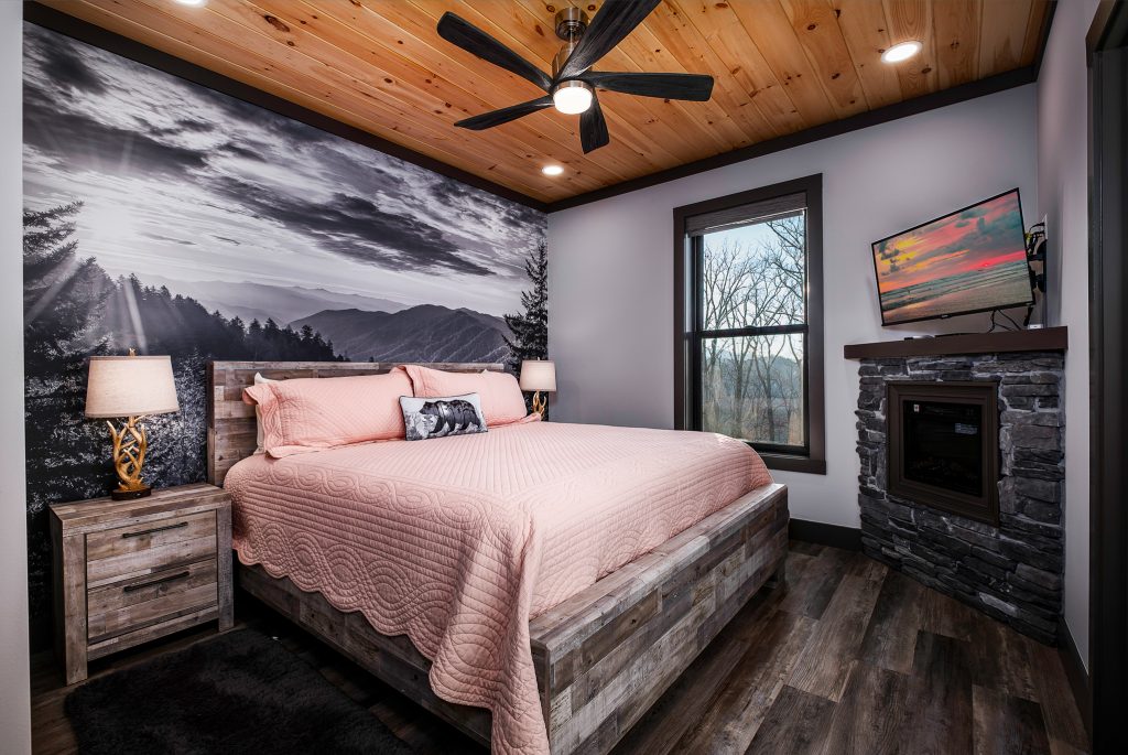 Pink bedroom with fireplace at a vacation rental in Gatlinburg, Tennessee.
