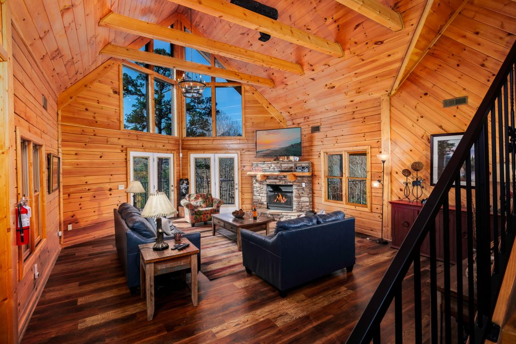 Log great room from staircase at a vacation rental in Gatlinburg, Tennessee.