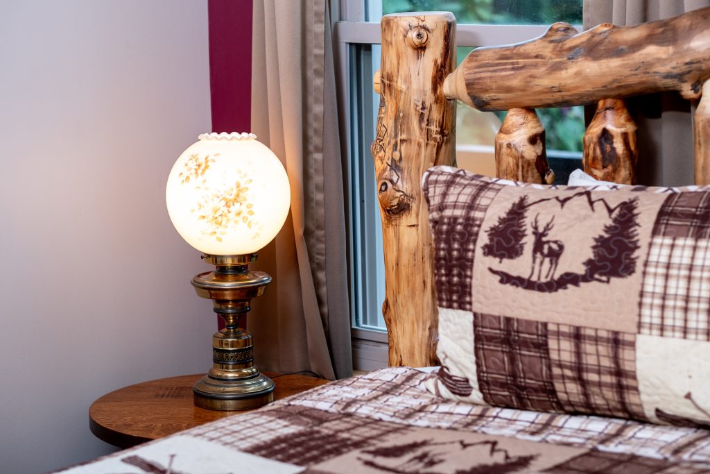 Rustic bear pillow bedroom detail at a vacation rental in Gatlinburg, Tennessee.