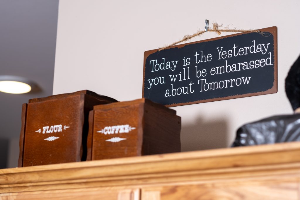 Humorous cabin sign decor detail at a vacation rental in Gatlinburg, Tennessee.
